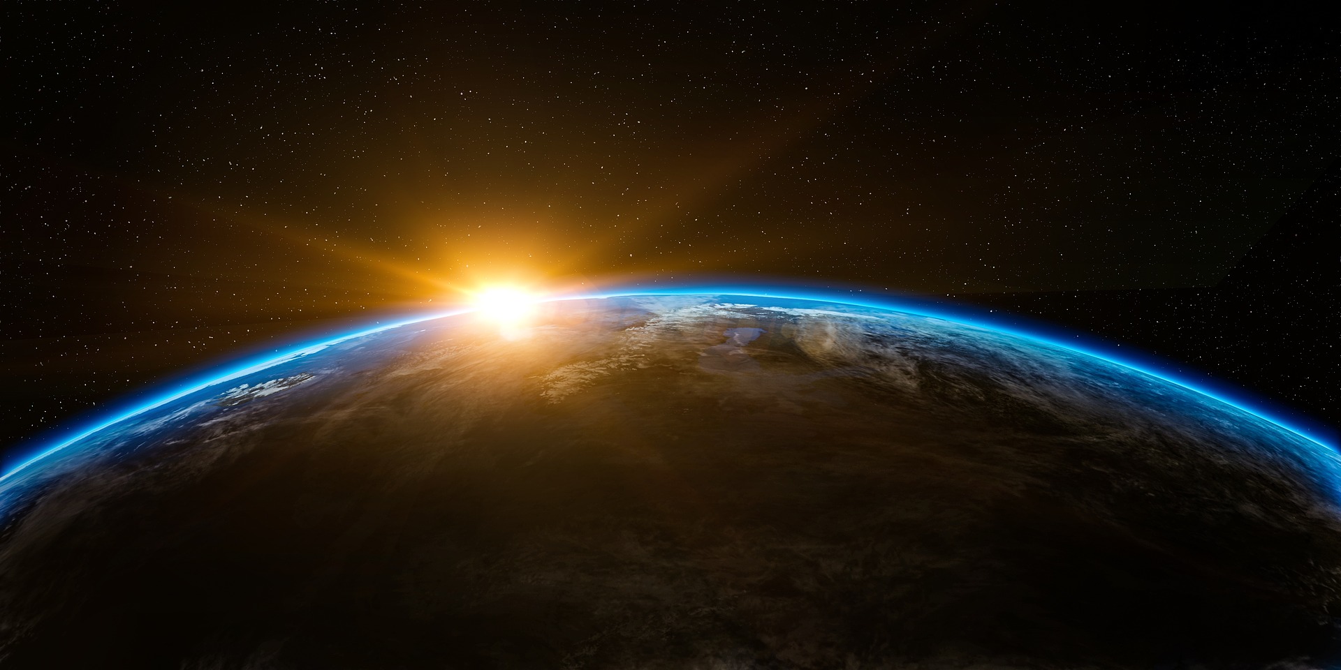 avoiding the passive voice: the earth from space with the sun coming up over its edge